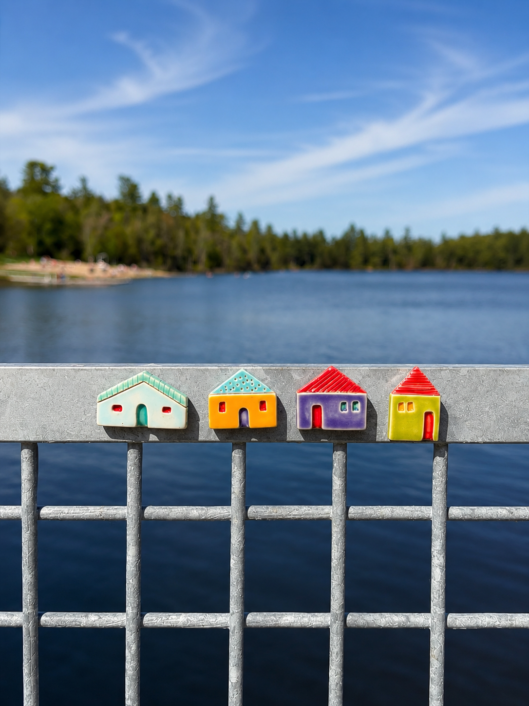 A group of colourful ceramic houses outdoors